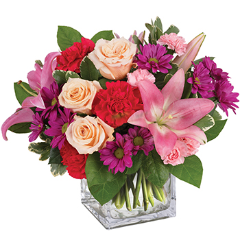 Code: A304. Name: Enchanted Garden. Description: Take a wondrous walk through this enchanted garden of soft peach Roses and pink Lilies with pink and red Carnations plus vivid purple daisies. Price: NZD $125.95