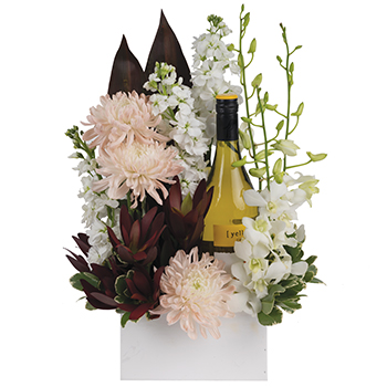 Code: T318. Name: Scarlett. Description: Soft and bubbly this arrangement including Orchids native +ACY- garden flowers with bottle of wine is sure to delight everyone. Price: NZD $192.95